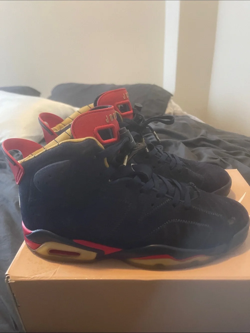 Jordan Men’s Athletic Shoes Navy Blue with Red and Gold Accents